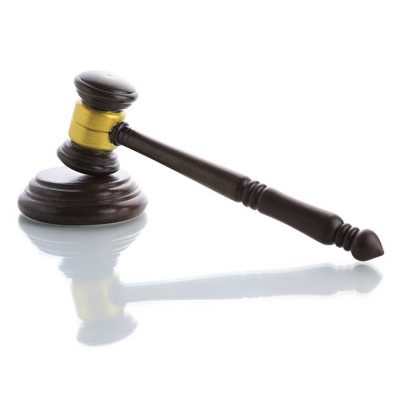 Wooden judges gavel, Umbrella Insurance